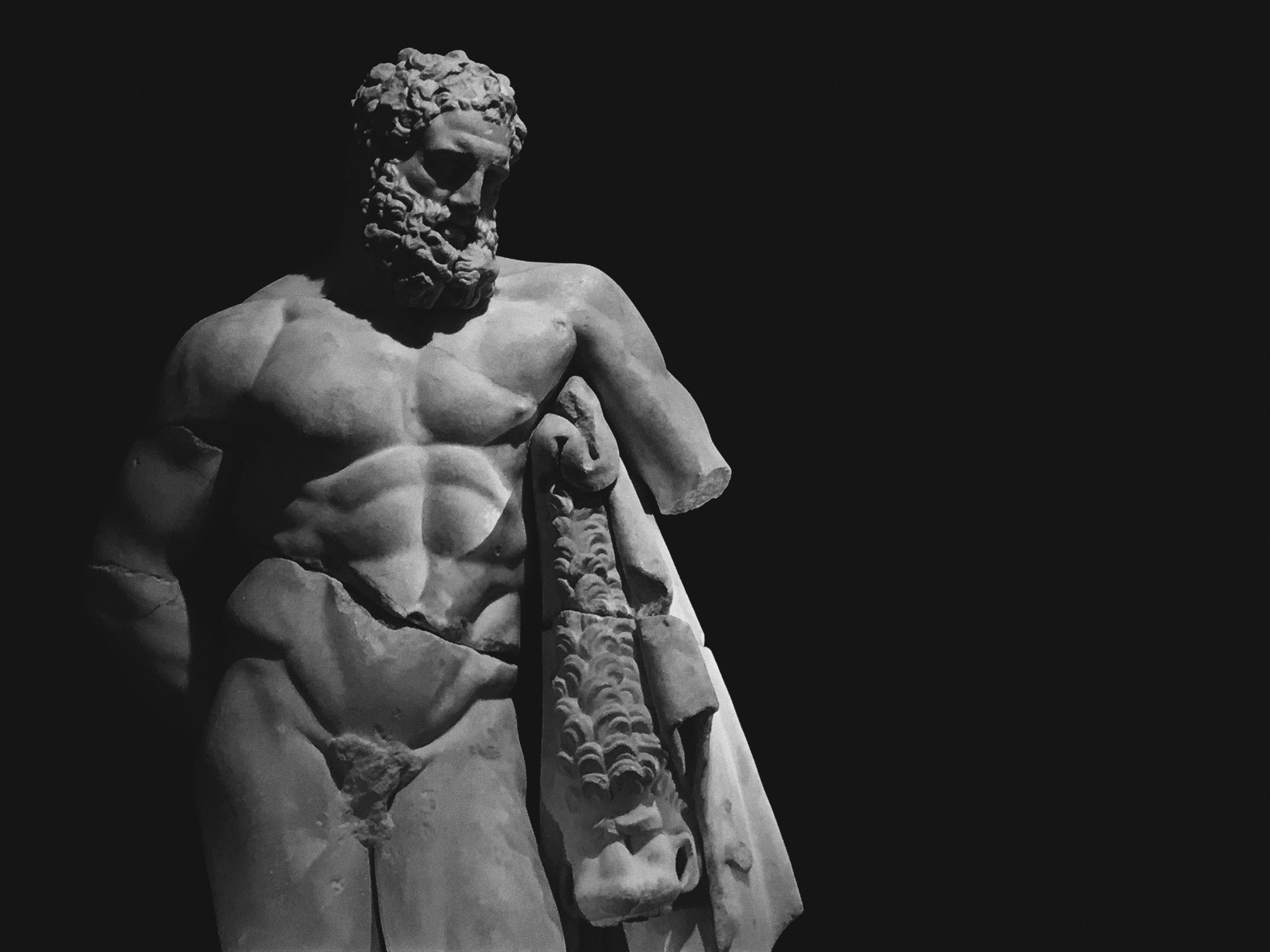 Grayscale Photo of Greek Statue 